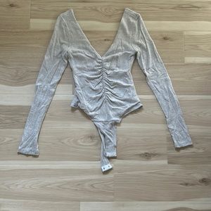 Gray sweater v-neck and low back body suit